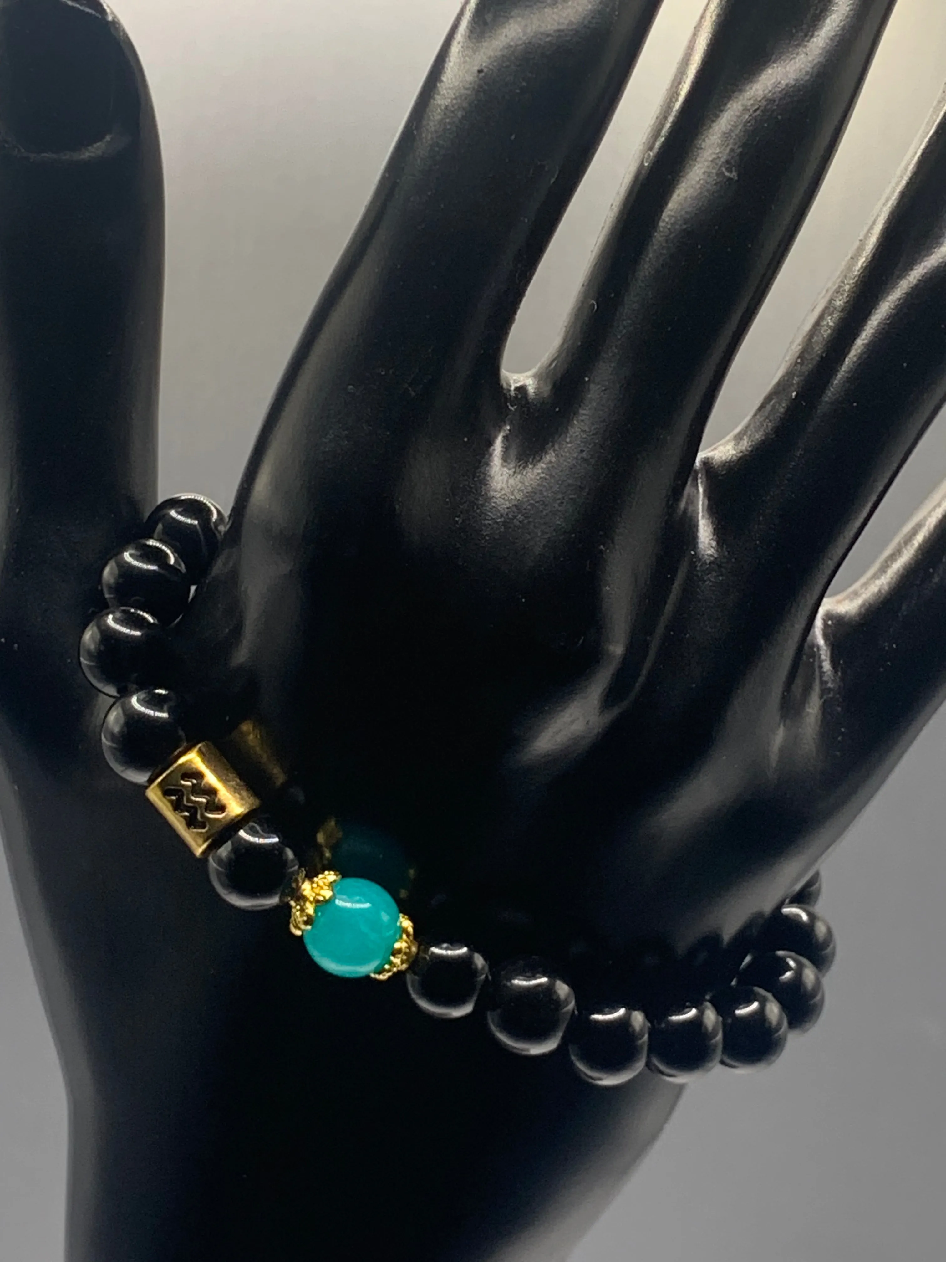 Aquarius Zodiac black obsidian with aquamarine chalcedony semi precious stone/crystal elastic beaded bracelet with gold accents